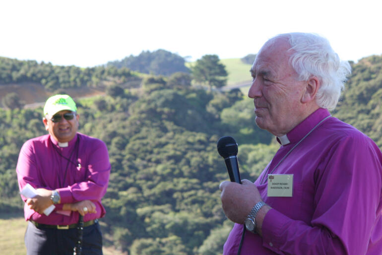 Bishop Richard Randerson speaks during a General Synod Hīnota Whānui visit to Oihi, as Bishop Te Kitohi Pikaahu looks on.