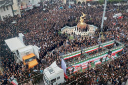 A huge crowd gathers in a square for Iranian children's funerals