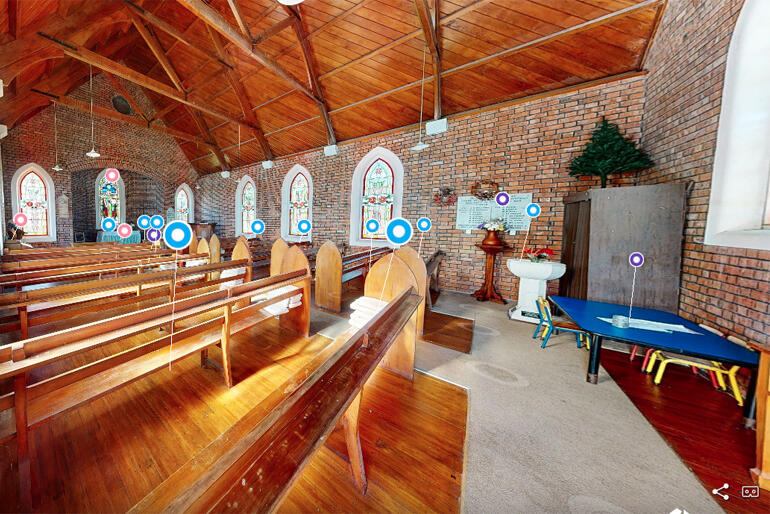 Entering the historic church visitors can select circular markers to view more details or hear stories from its past and present life.
