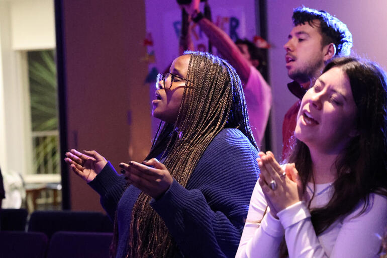 Rev Ciru Muriuki, Maya and Jesse Duckworth join in opening worship at The Abbey 2026.