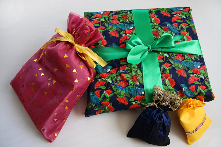 Eco-friendly fabric wrappings reduce waste and save money as families reuse them again each Christmas.
