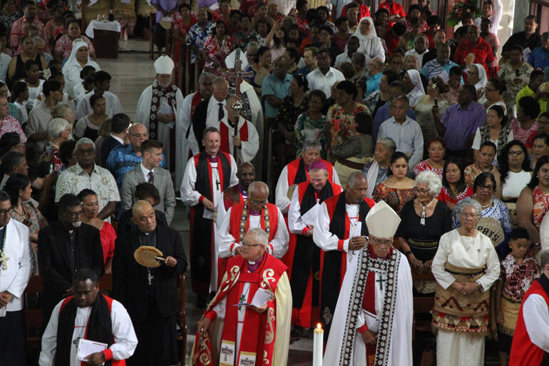 Bishops Richard Wallace and Ngarahu Katene reach the sanctuary during the opening procession.